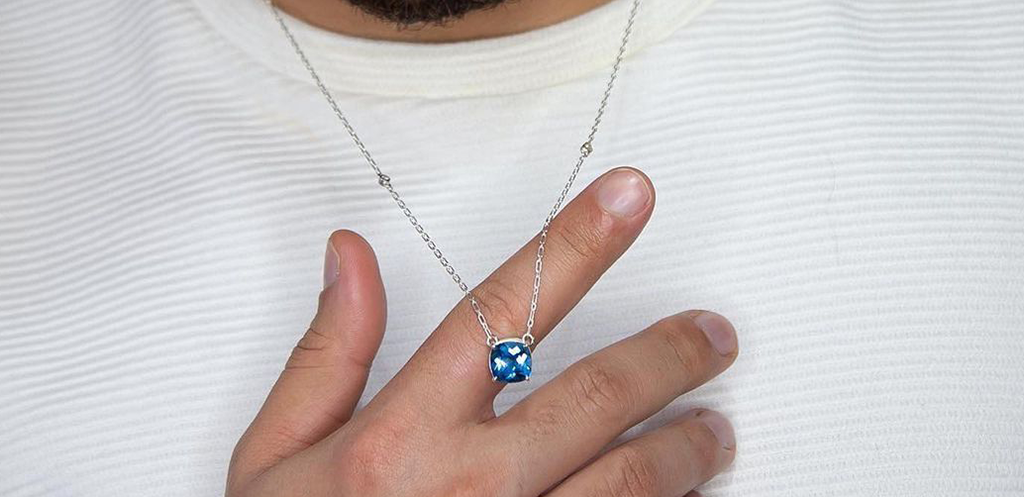 Man wearing a gemstone necklace